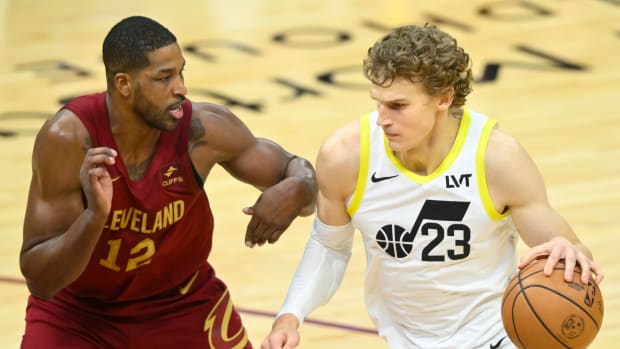 Dec 20, 2023; Cleveland, Ohio, USA; Cleveland Cavaliers center Tristan Thompson (12) defends Utah Jazz forward Lauri Markkanen (23) in the fourth quarter at Rocket Mortgage FieldHouse.